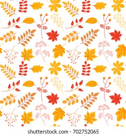 Autumn vector seamless pattern with colorful leaves and twigs in yellow and red colors for textile, clothing and paper design