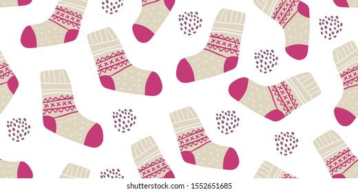 Autumn vector seamless pattern with cute colorful socks on white. Funny doodle socks with different patterns. Cute winter and autumn holidays hygge textile design in scandinavian style