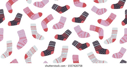 Autumn vector seamless pattern with cute colorful socks on white. Funny doodle socks with different patterns. Cute winter and autumn holidays hygge textile design in scandinavian style