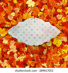 Autumn vintage greeting card on colorful leaves background with copy space. EPS 10 vector file included