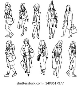 Autumn women's fashion. Hand drawn girls on white background.Vector sketch illustration.