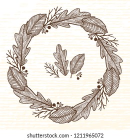 Autumn wreath of forest elements. Leaves, acorns, branches and berries.
