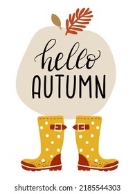 Autumn yellow rubber boots on a white background. Lettering "Hello autumn". Leaf fall and fall weather. waterproof shoes