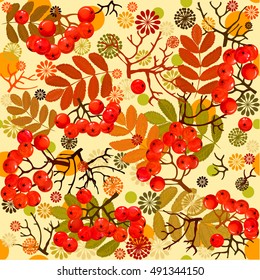 Autumnal pattern from leaves and berries of mountain ash. Grapes rowan. Repeating pattern autumn theme. Texture for textiles with autumn objects. Leaves. Grapes rowan. 