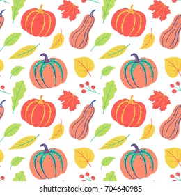 Autumnal seamless pattern with pumpkin, leaves, berries. Vector harvest falling background