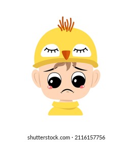 Avatar of boy with big eyes and sad emotions, depressed face, down eyes in yellow chicken hat. Child with melancholy expression for Easter, New Year or costume for party. Vector flat illustration