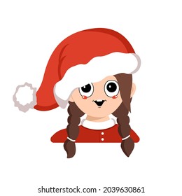 Avatar of a girl with big eyes and a wide happy smile in a red Santa hat. Cute kid with a joyful face in a festive costume for New Year and Christmas. Head of adorable child with joyful emotions