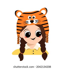 Avatar of a girl with big eyes and a wide smile in a tiger hat. Cute kid with a joyful face in a festive costume for New Year, Christmas and holiday. Head of adorable child with happy emotions