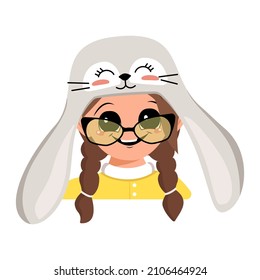 Avatar of girl with big eyes and wide happy smile in cute rabbit hat with glasses. Head of child with joyful face for holiday Easter, New Year or carnival costume for party. Vector flat illustration