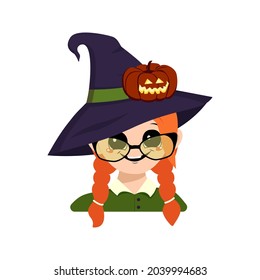 Avatar of a girl with red hair, big eyes, glasses and a wide happy smile in a pointed witch hat with a pumpkin. The head of a child with a joyful face. Halloween party decoration