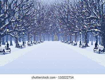 Avenue of trees, street lamps and benches in a snow covered park