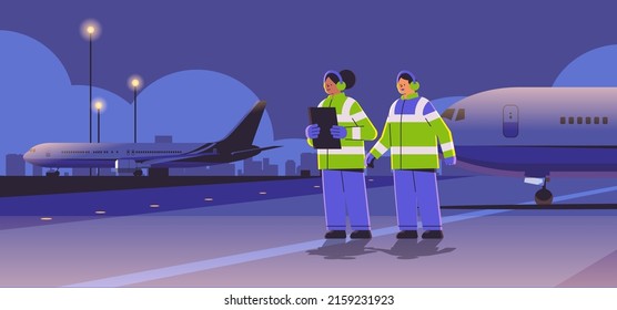 aviation marshallers supervisors near aircraft air traffic controllers airline workers in signal vests professional airport staff
