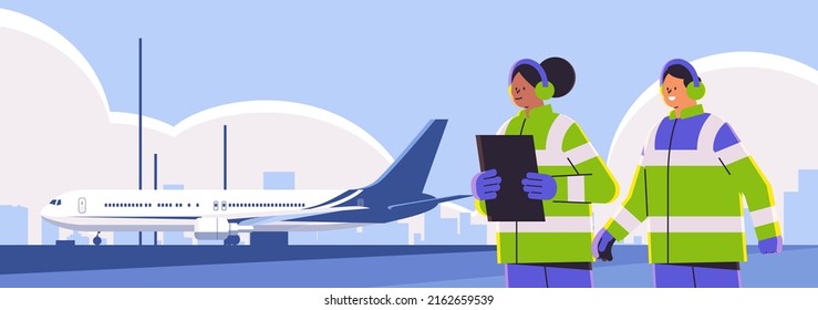 aviation marshallers supervisors near aircraft air traffic controllers airline workers in signal vests professional airport staff