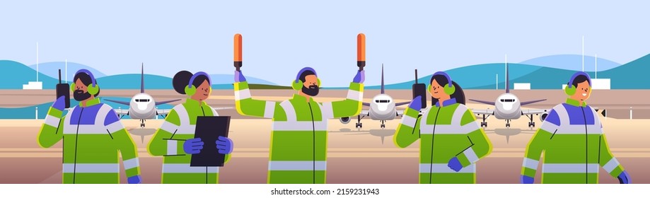 aviation marshallers supervisors team in uniform air traffic controllers airline worker in signal vests professional airport staff