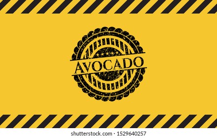 Avocado grunge black emblem with yellow background, warning sign. Vector Illustration. Detailed.