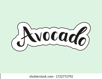 Avocado. Handgeschriebener kalligrafischer Text mit weißem und schwarzem Schlaganfall auf grünem Hintergrund. Bezeichnung der Frucht. Lettergrafik