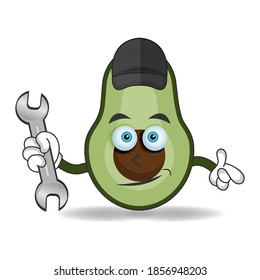 The Avocado mascot character becomes a mechanic. vector illustration