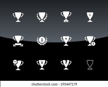 Awards and cup icons on black background. Vector illustration.