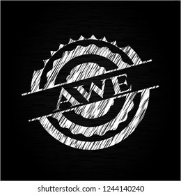 Awe chalk emblem written on a blackboard