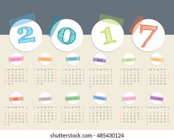 Awesome calendar design with color tapes and white disks for year 2017