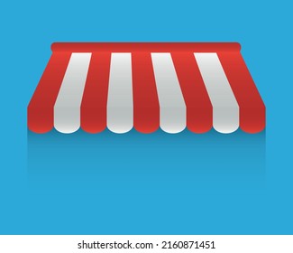 Awning isolated on white background. Striped red and white sunshade for shops, cafes and street restaurants. Outside canopy from the sun