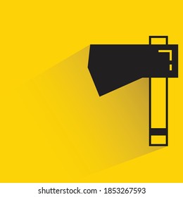 ax with shadow on yellow background