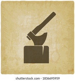 Axe in log silhouette on vintage background