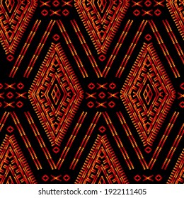 Aztec Essence tribal seamless pattern. Ethnic Navajo style - orange red ornament on a black background