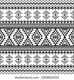 Aztec ethnic tribal seamless pattern with geometric shapes in black and white color. Design for textile, fabric, clothes, curtain, carpet, batik, ornament, wallpaper, background, wrapping, paper.