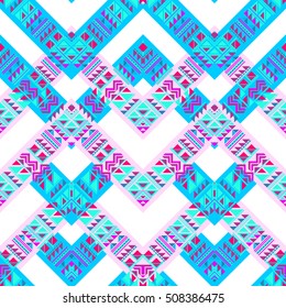 Aztec pattern ethnic ornament seamless blue pink color. Zigzag pattern with tribal elements background. Primitive triangle ornament for traditional design.