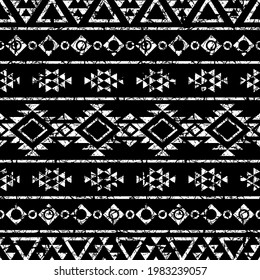 Aztec stylized print template for fabric and paper. Black and white seamless pattern with ethnic ornament and grunge effect. Tribal style background. Summer fashion, boho. 