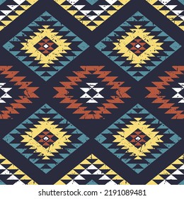 Aztec stylized print template for fabric and paper. Seamless pattern with ethnic ornament and grunge effect. Tribal style background. Summer fashion, boho.