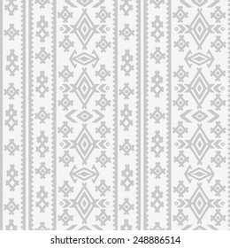 Aztec tribal art halftone seamless pattern in white and gray. Ethnic mexican print. Folk light border repeating background texture