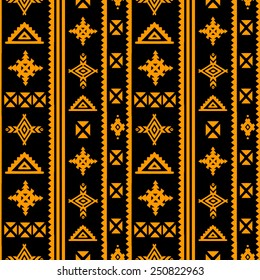 Aztec tribal art seamless pattern in black and gold. Ethnic mexican print. Folk border repeating background texture