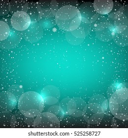 Azure bokeh background with snow. Christmas and New Year backdrop