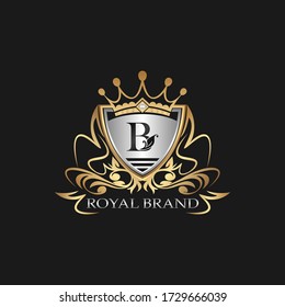 B Letter Gold Shield Logo. Elegant vector logo badge template with alphabet letter on shield frame ornate style design.