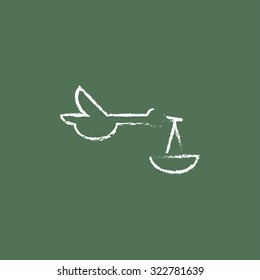Baby basket with stork hand drawn in chalk on a blackboard vector white icon isolated on a green background.