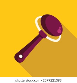 Baby beanbag rattle toy lying on a yellow background with a long shadow