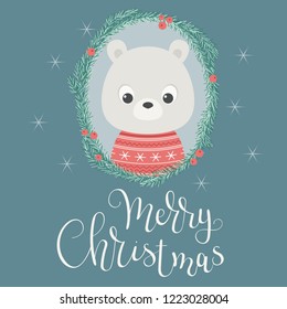 Baby bear in a Christmas wreath. Merry Christmas hand lettering. Vector illustration