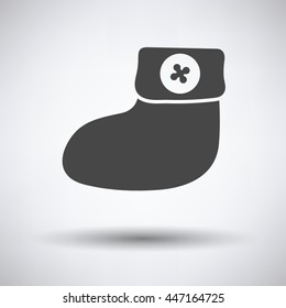 Baby bootie icon on gray background, round shadow. Vector illustration.