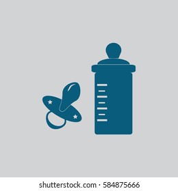Baby bottle with milk and soft rubber pacifier