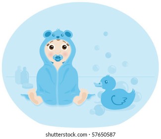 Baby boy in a hooded towel with cute bear ears.
