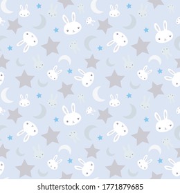 Baby boy nursery seamless pattern with white bunnies and cute rabbits and stars on light blue background.