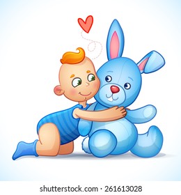 Baby boy redhead hugs bunny toy on a white background. Easter bunny plush toy. Little boy lovingly looking at the bunny