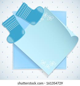Baby boy shower card. Knitted socks on light background. Arrival card with place for your text.