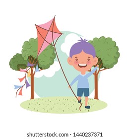 baby boy standing with kite in the hand