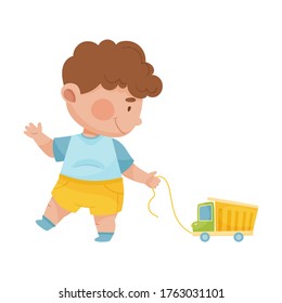 Baby Boy Walking And Pulling Toy Car Vector Illustration