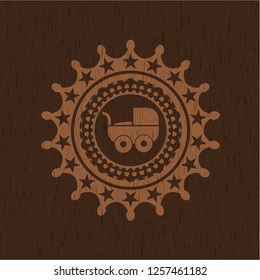 baby cart icon inside badge with wooden background