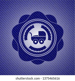 baby cart icon inside badge with denim background