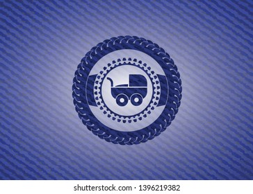 baby cart icon inside badge with jean texture